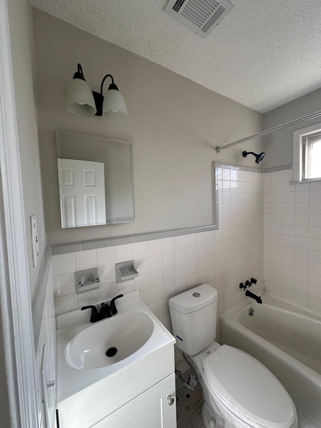 1516 N Avalon Cir, Charleston, SC 29407 - bathroom featuring a textured ceiling, toilet,  shower combination, vanity, and tile walls