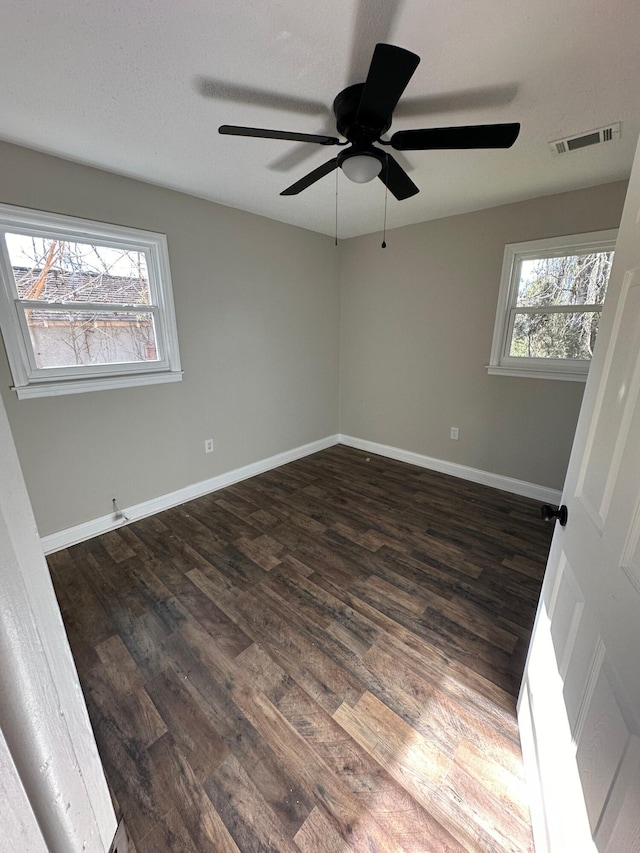 1516 N Avalon Cir, Charleston, SC 29407 - spare room with dark wood-style floors, a ceiling fan, and baseboards