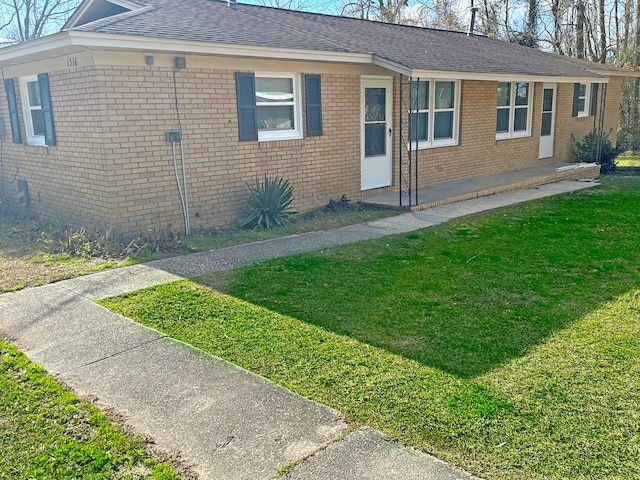 1516 N Avalon Cir, Charleston, SC 29407 - view of front of property with a front yard, brick siding, and roof with shingles