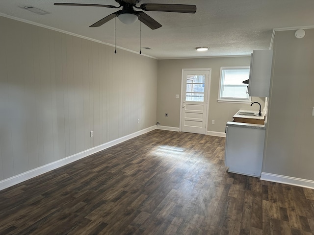 1516 N Avalon Cir, Charleston, SC 29407 - unfurnished dining area with a sink, ceiling fan, dark wood-style floors, ornamental molding, and baseboards