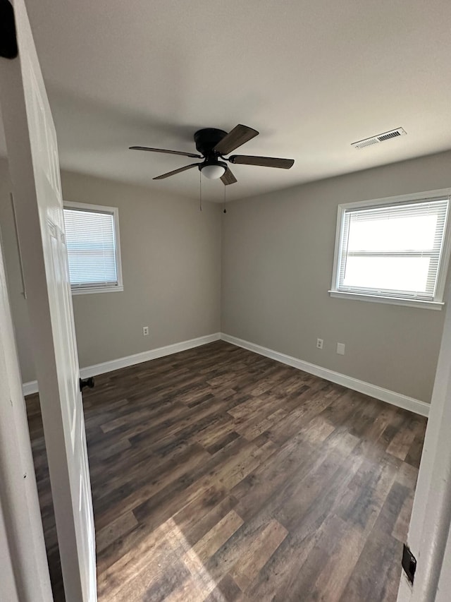 1516 N Avalon Cir, Charleston, SC 29407 - unfurnished room with plenty of natural light, ceiling fan, dark wood-style flooring, and baseboards