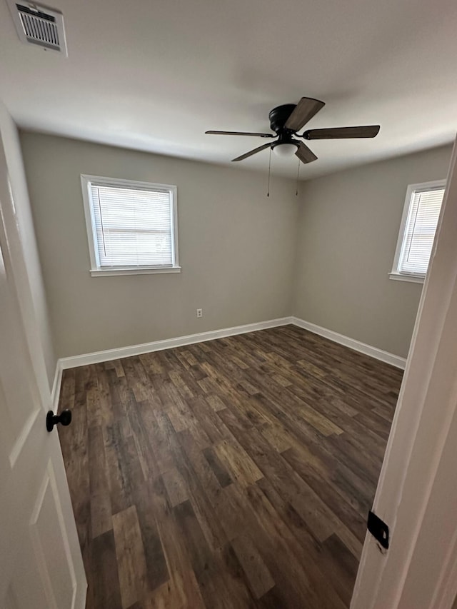 1516 N Avalon Cir, Charleston, SC 29407 - spare room with dark wood finished floors, a ceiling fan, and baseboards