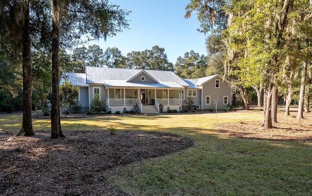 ranch-style house with covered porch and a front yard