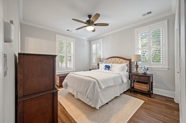 bedroom featuring ceiling fan, dark hardwood / wood-style floors, and ornamental molding