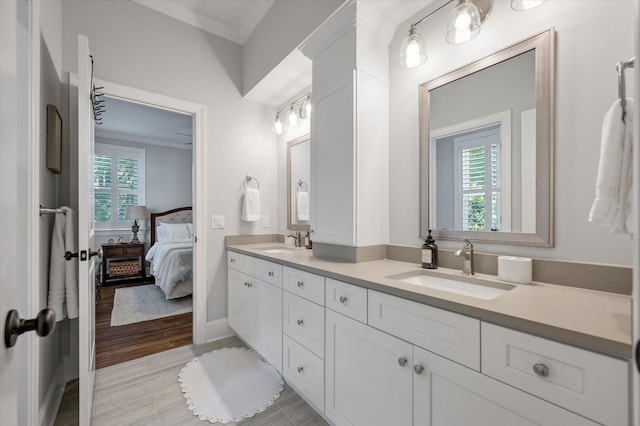 bathroom featuring vanity and ornamental molding