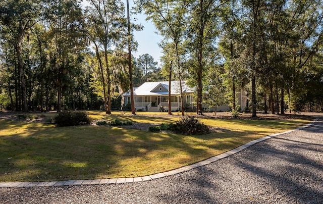 view of yard with covered porch