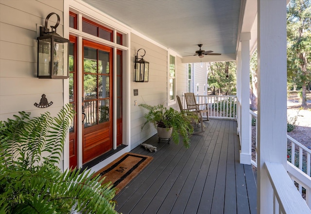 exterior space with ceiling fan and a porch