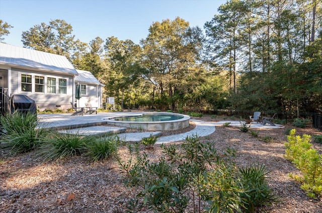 view of pool featuring area for grilling and a patio