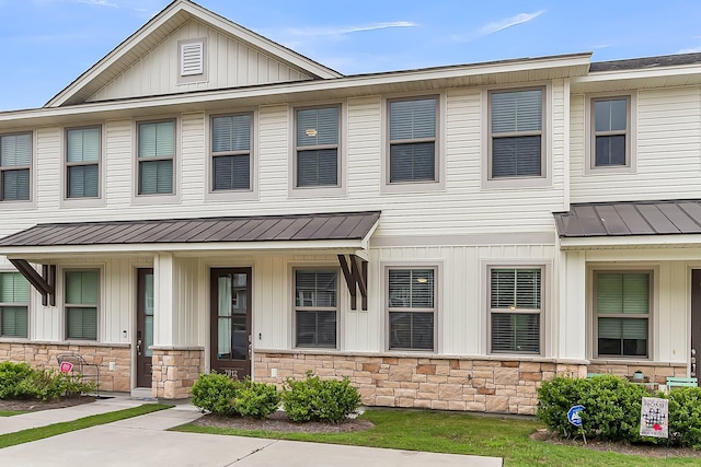 7812 Park Gate Dr, North Charleston, SC 29418 - townhome / multi-family property featuring a standing seam roof, stone siding, metal roof, and board and batten siding