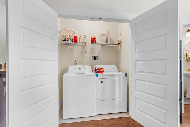 7812 Park Gate Dr, North Charleston, SC 29418 - washroom featuring independent washer and dryer and light wood-style flooring