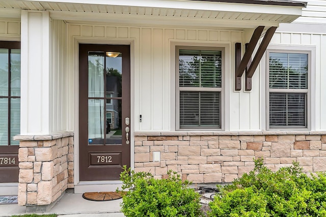 7812 Park Gate Dr, North Charleston, SC 29418 - property entrance featuring stone siding, board and batten siding, and covered porch