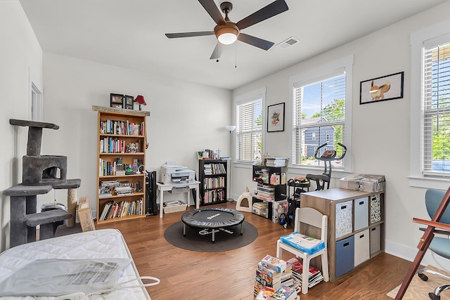 7812 Park Gate Dr, North Charleston, SC 29418 - playroom with a ceiling fan, wood finished floors, and baseboards