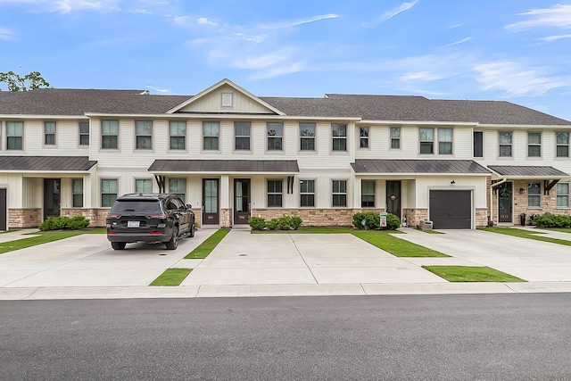 7812 Park Gate Dr, North Charleston, SC 29418 - multi unit property featuring metal roof, stone siding, a standing seam roof, board and batten siding, and driveway
