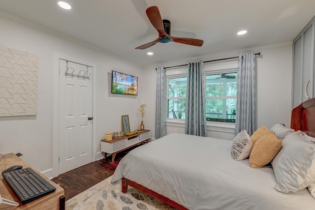 bedroom featuring crown molding, dark wood-style floors, recessed lighting, a ceiling fan, and baseboards
