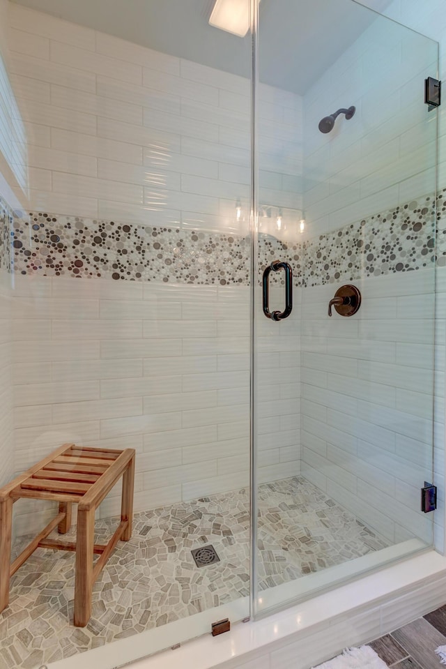 bathroom with a shower stall