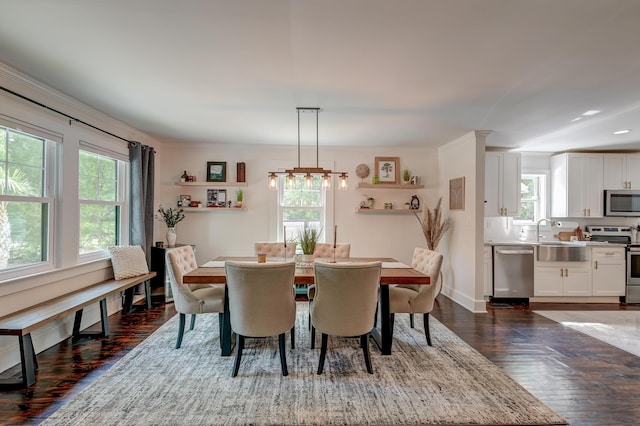 dining space with dark wood finished floors