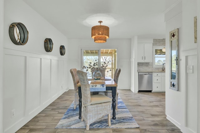 dining room featuring light hardwood / wood-style floors and sink