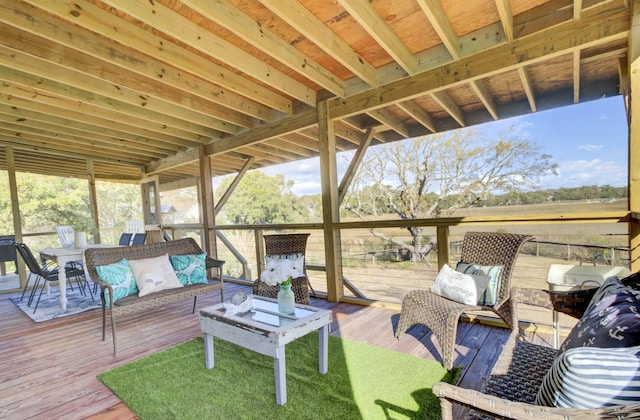 wooden terrace with an outdoor hangout area