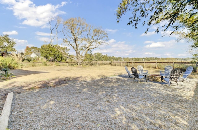 view of yard with an outdoor fire pit