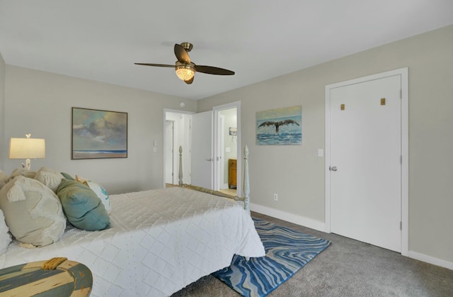 carpeted bedroom featuring ceiling fan and ensuite bathroom