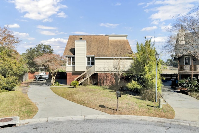 exterior space featuring a front lawn