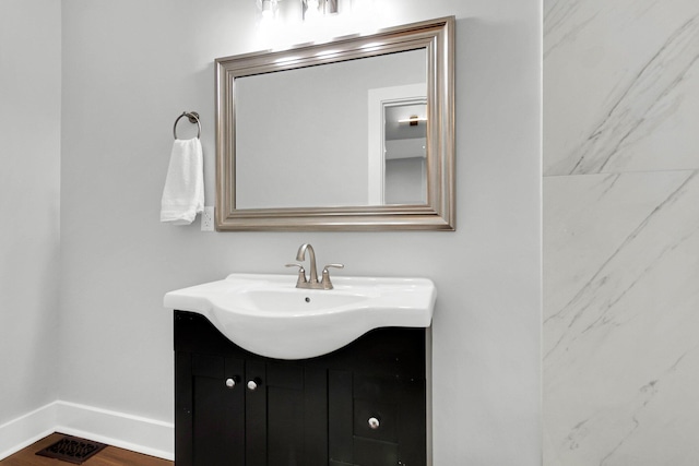 bathroom featuring vanity and wood-type flooring