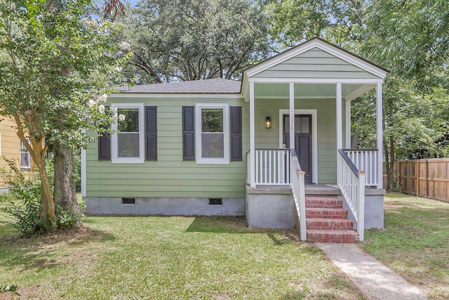 bungalow-style house with a front yard