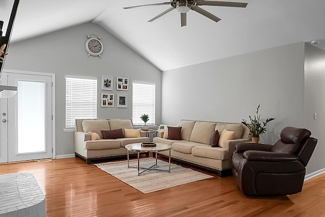 living room featuring hardwood / wood-style floors, a wealth of natural light, and ceiling fan