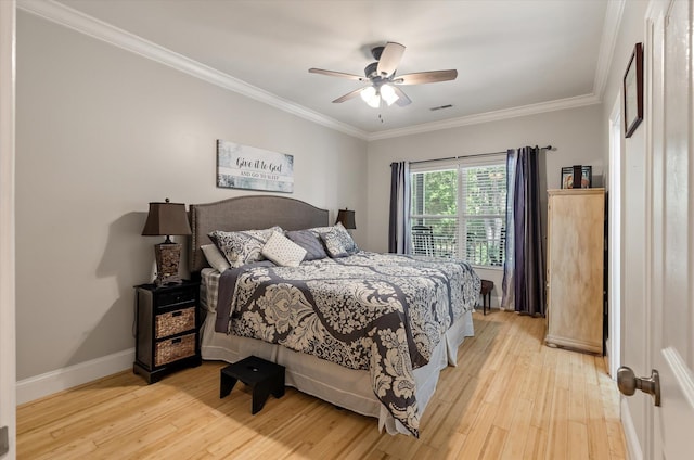 2649 Starfish Dr, Johns Island, SC 29455 - bedroom with light wood finished floors, crown molding, baseboards, and ceiling fan