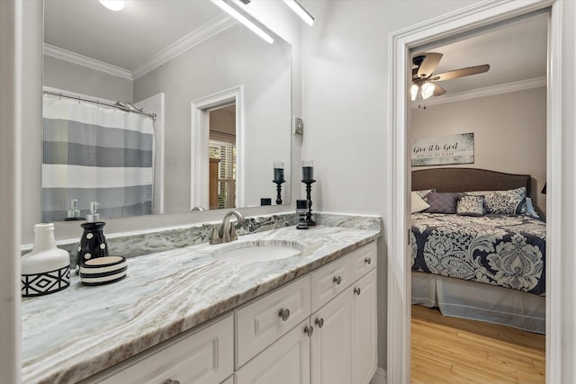 2649 Starfish Dr, Johns Island, SC 29455 - full bath with crown molding, vanity, wood finished floors, a ceiling fan, and ensuite bath