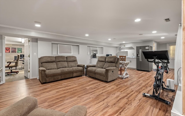2649 Starfish Dr, Johns Island, SC 29455 - living room featuring light wood-style flooring and recessed lighting
