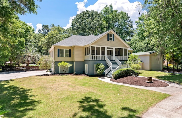 2649 Starfish Dr, Johns Island, SC 29455 - view of front of property featuring a sunroom, stairs, and a shingled roof