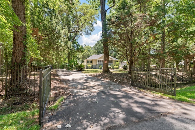 2649 Starfish Dr, Johns Island, SC 29455 - view of asphalt driveway featuring a gated entry