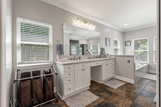 2649 Starfish Dr, Johns Island, SC 29455 - full bath featuring double vanity, a garden tub, ornamental molding, stone tile flooring, and baseboards