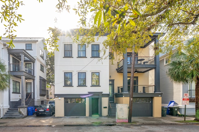 view of front of home featuring a garage and a balcony