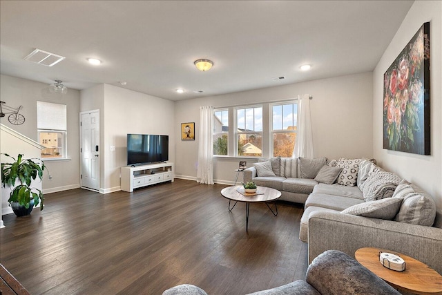 living room with dark hardwood / wood-style flooring