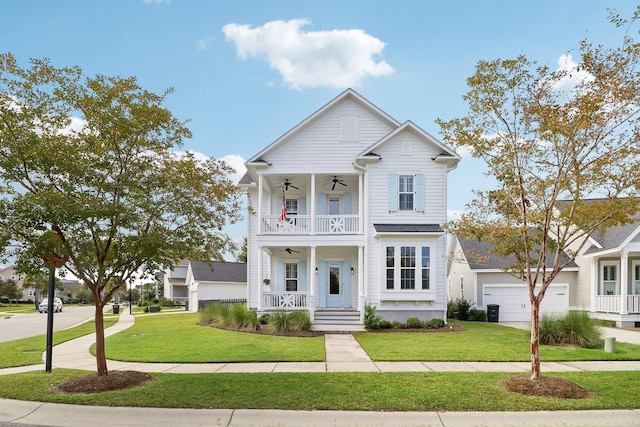 view of front facade with a porch, a balcony, a front yard, and a garage