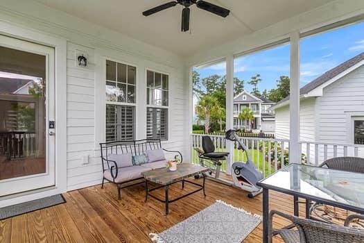 sunroom / solarium with ceiling fan