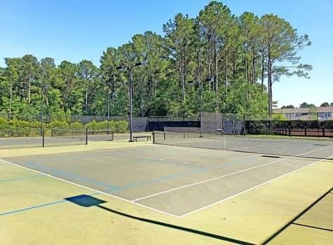 view of tennis court featuring basketball court