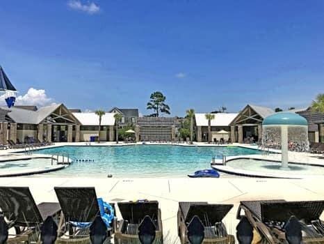 view of swimming pool with pool water feature