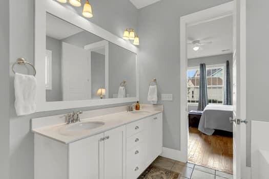 bathroom with tile patterned floors and vanity