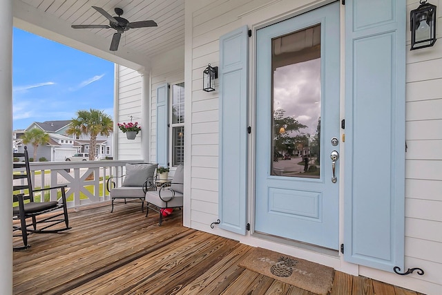 deck featuring a porch and ceiling fan