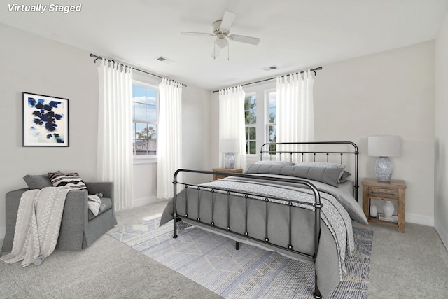 carpeted bedroom with ceiling fan