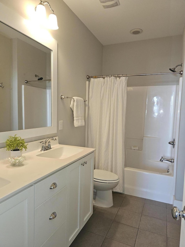 full bathroom with shower / tub combo with curtain, vanity, toilet, and tile patterned flooring