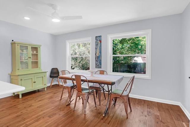 dining space with a ceiling fan, baseboards, recessed lighting, and light wood-style flooring