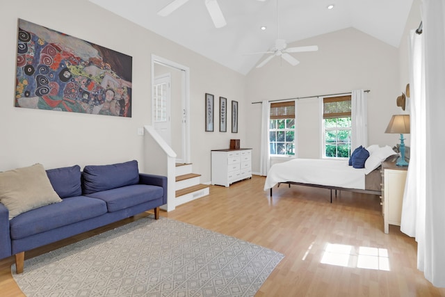 bedroom featuring high vaulted ceiling, a ceiling fan, recessed lighting, and wood finished floors