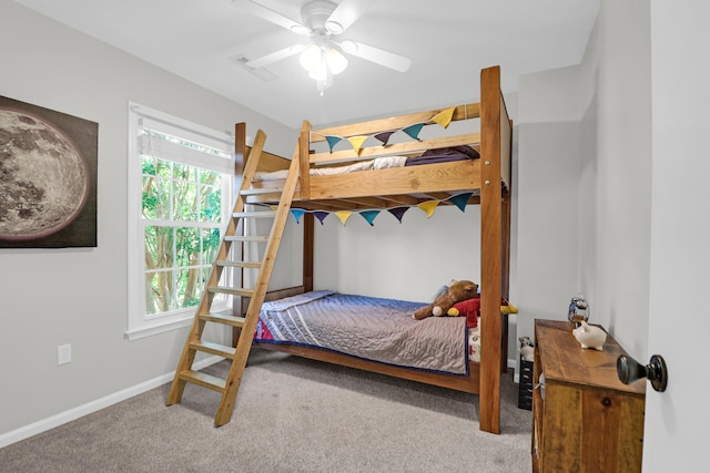 bedroom with carpet floors, baseboards, ceiling fan, and visible vents