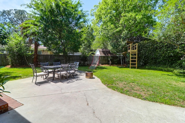 view of patio featuring outdoor dining area and a fenced backyard