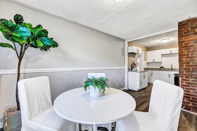 2674 Houston St, North Charleston, SC 29405 - dining space with a textured ceiling and dark wood-type flooring