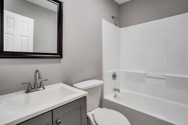 bathroom with toilet, vanity, and washtub / shower combination